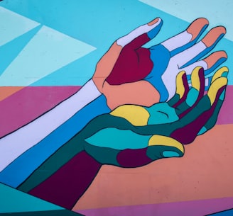 illustration of two cartoonish multi coloured hands entwined on a similarly colourful background