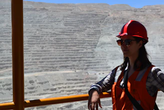 woman smiling beside railing