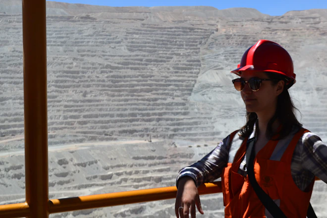 woman smiling beside railing