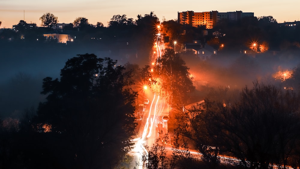 long exposure photography of vehicles and trees