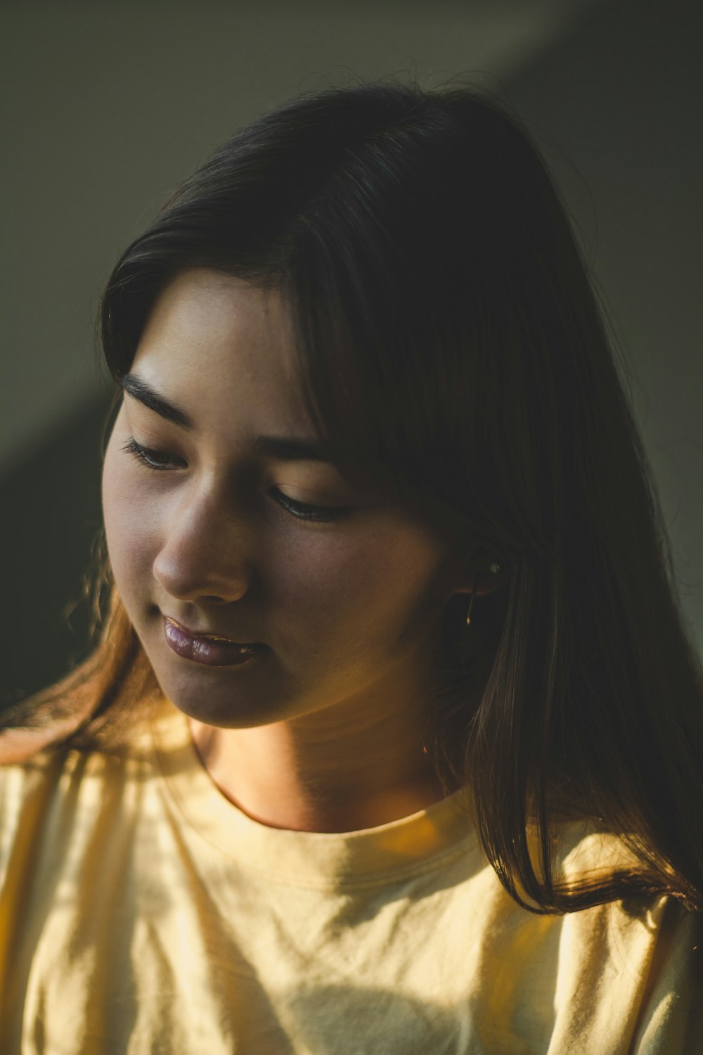 woman wears yellow crew-neck t-shirt