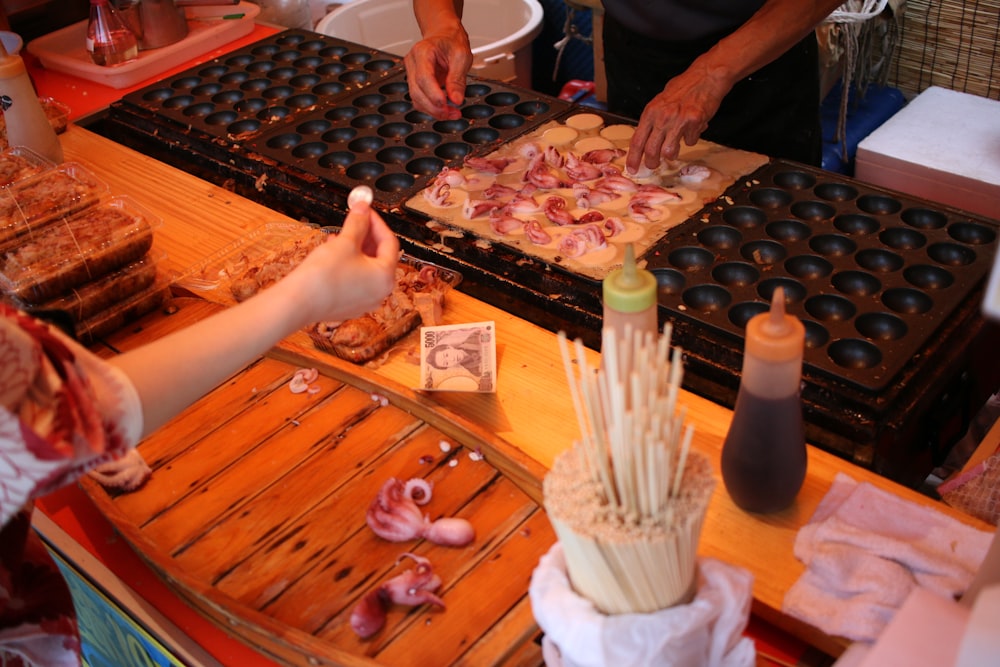 person cooking food on molder