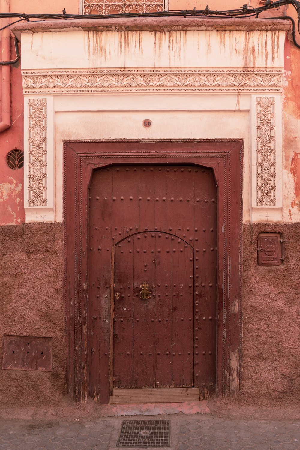 white concrete building showing closed door