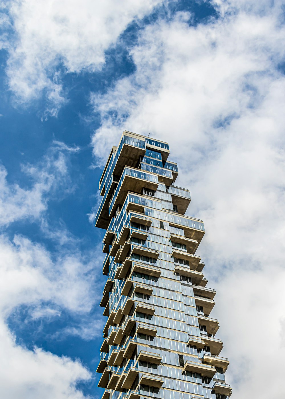 gray and blue curtain glass building