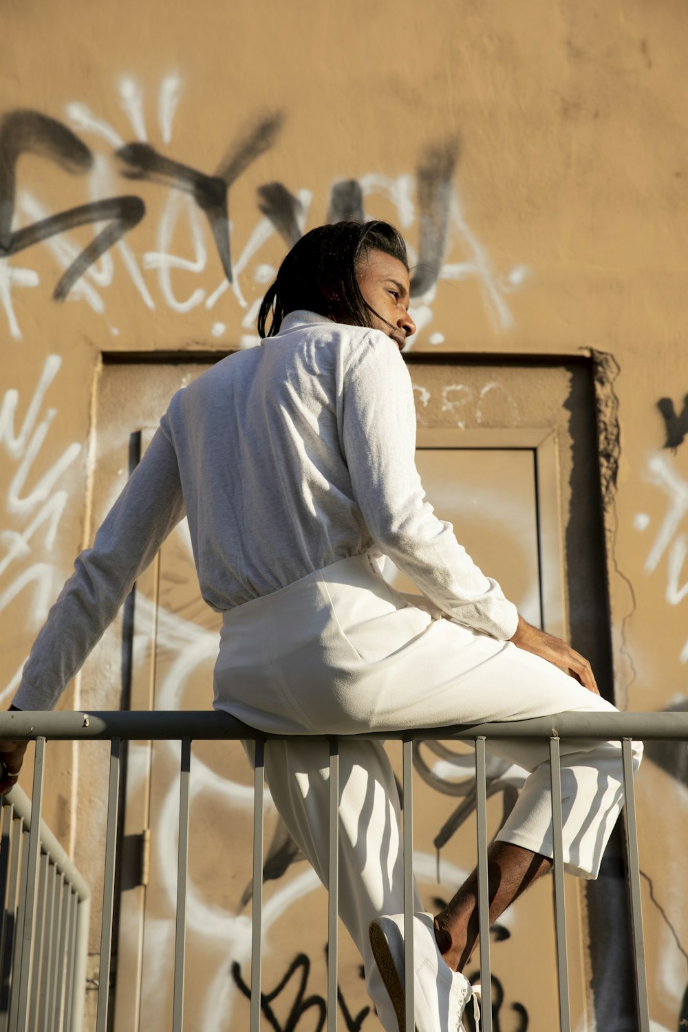 man sitting on ledge