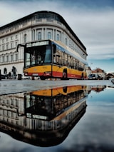 yellow parked bus near building