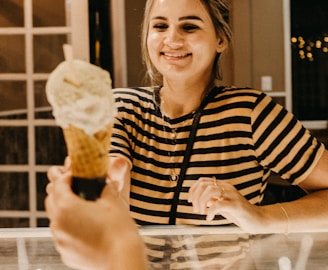 smiling woman reaching for ice cream