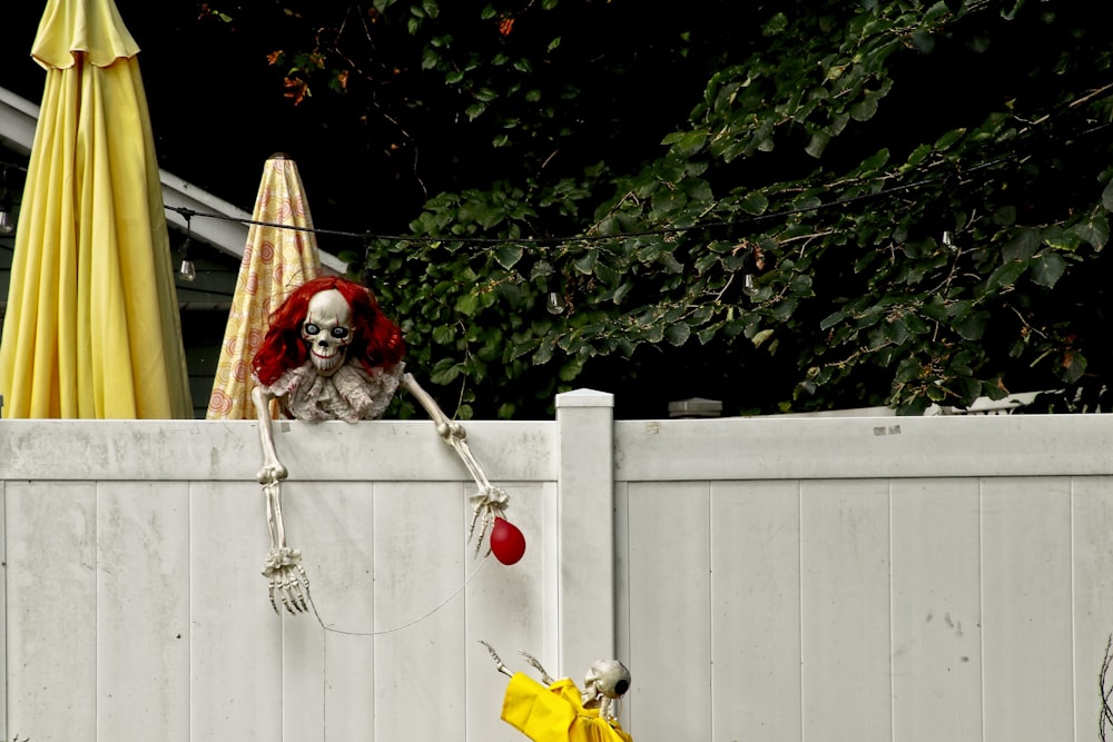 skeleton on fence during daytime