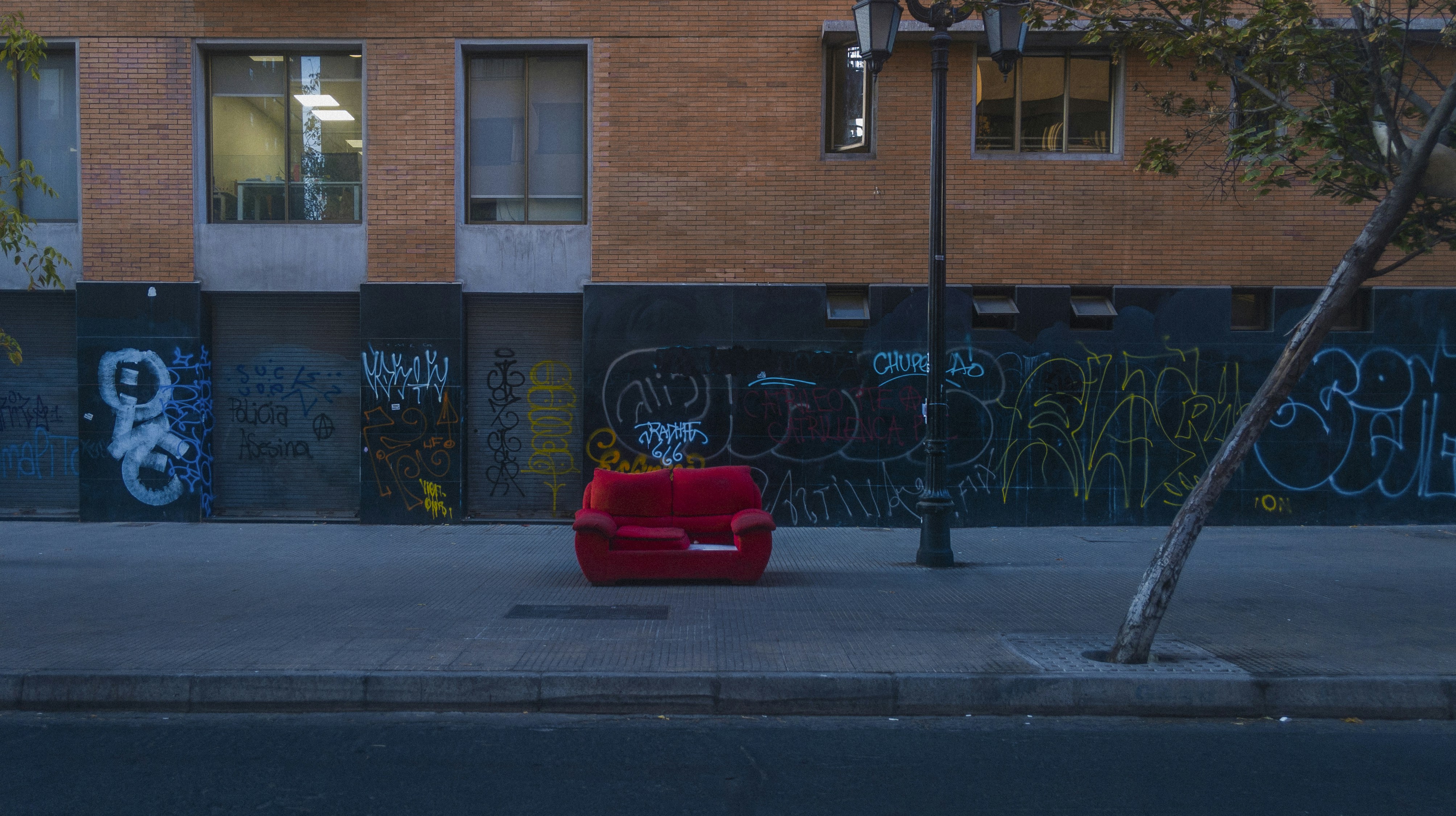 sofa on curb awaiting municipal pickup - unwanted sofa removal
