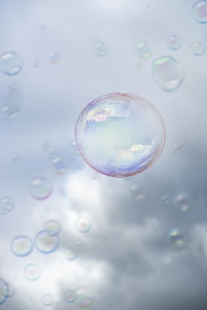 Clear soap bubbles floating in the air, like the Circus of Bubbles shows inside the Summerlin Library theater