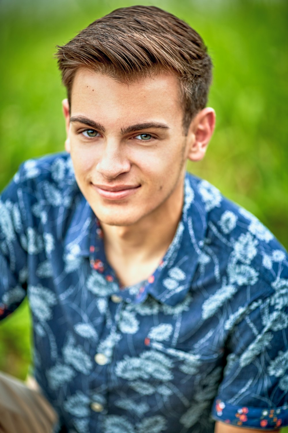 man wearing blue and white floral collared shirt