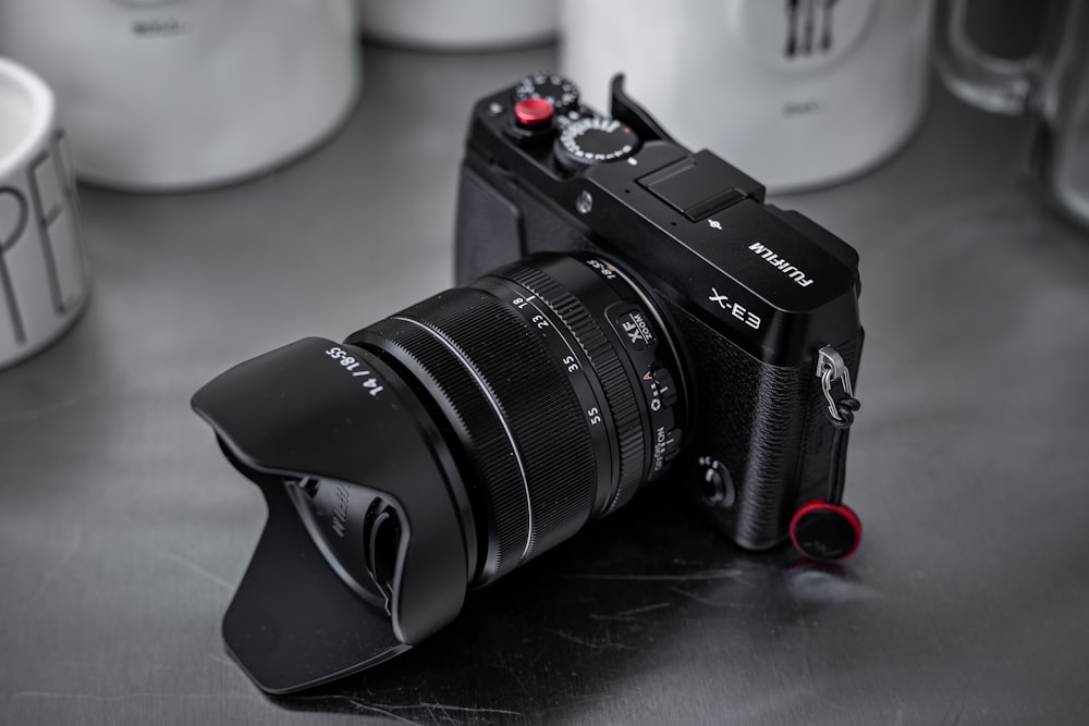 black Fujifilm DSLR camera