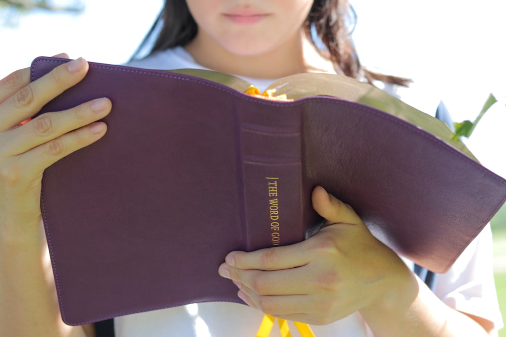 person holding book