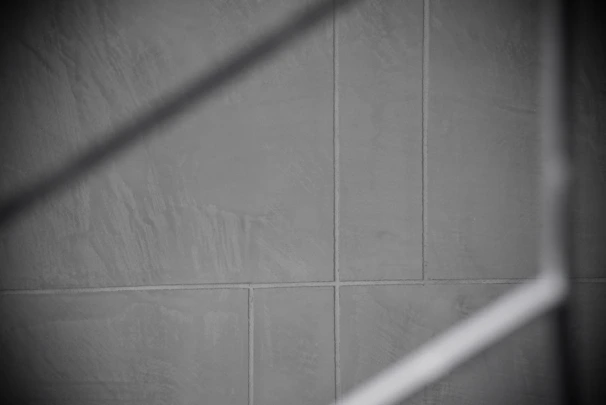 Grout cleaning transformation highlighting the contrast between dirty and refreshed grout lines.