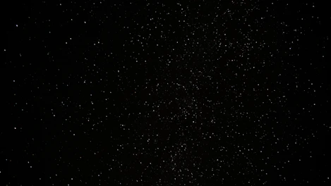 a black sky with a lot of stars
