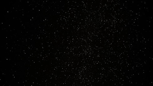 a black sky with a lot of stars