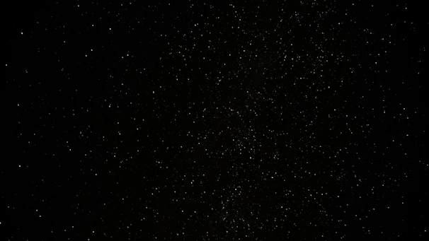 a black sky with a lot of stars
