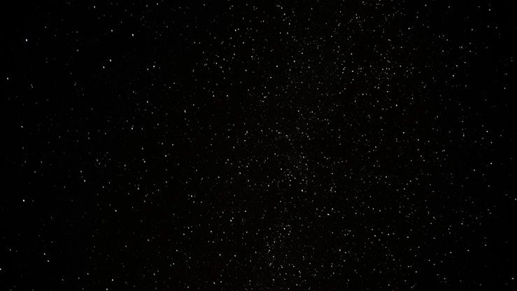 a black sky with a lot of stars