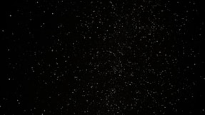 a black sky with a lot of stars