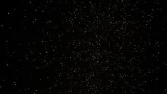 a black sky with a lot of stars