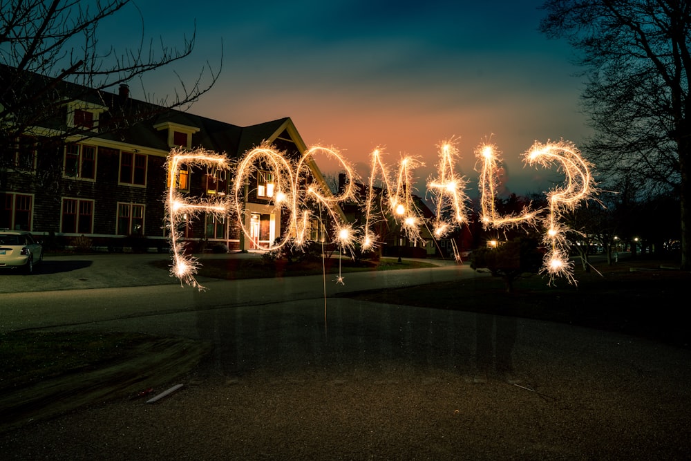 time-lapse photography of yellow formal? sparkler light signage