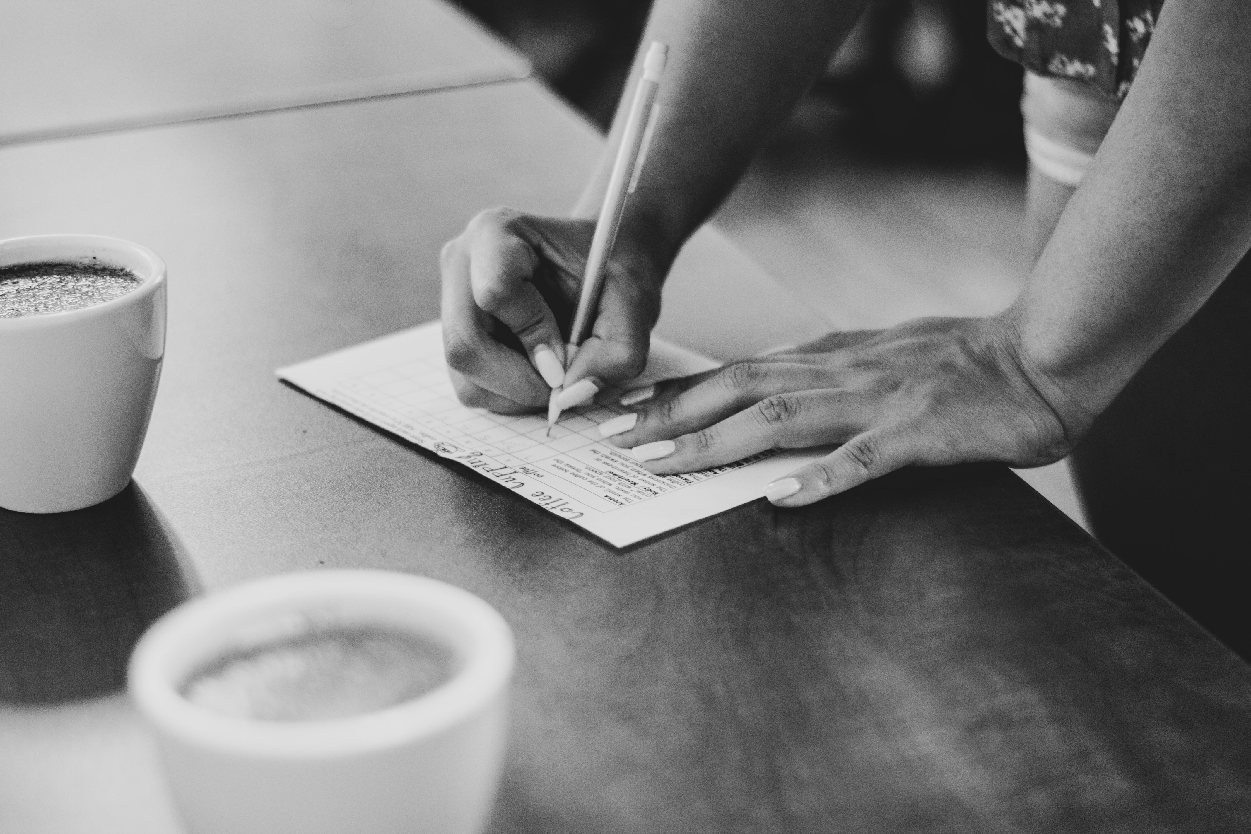 person writing on paper