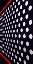 Close-up of a high-contrast grid card with thick black borders and glitchy hover effect.