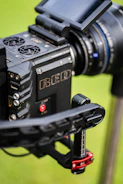 Close-up of a filmmaker reviewing footage on a high-resolution monitor.