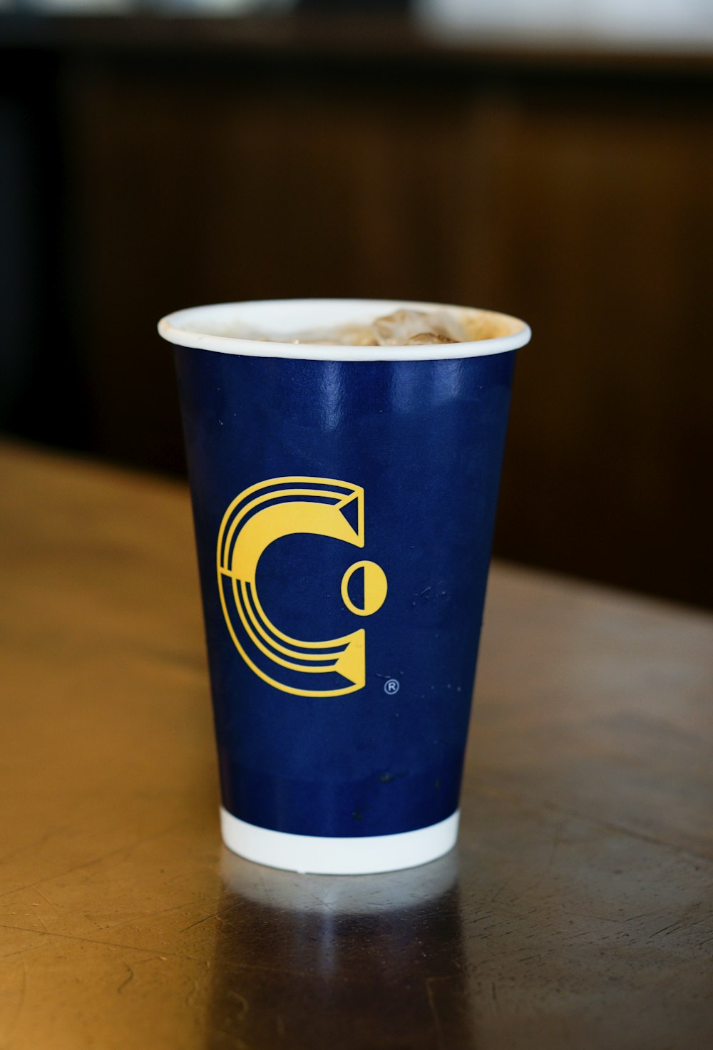 blue disposable cup on table