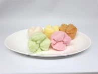 A colorful spread of mini vegetable muffins arranged on a festive party platter.