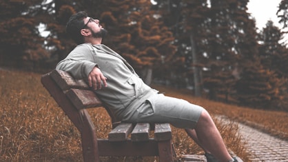 man sitting in bench-subtitle-Principle of Rest and Recovery-title-How to Get Lean Mass Body