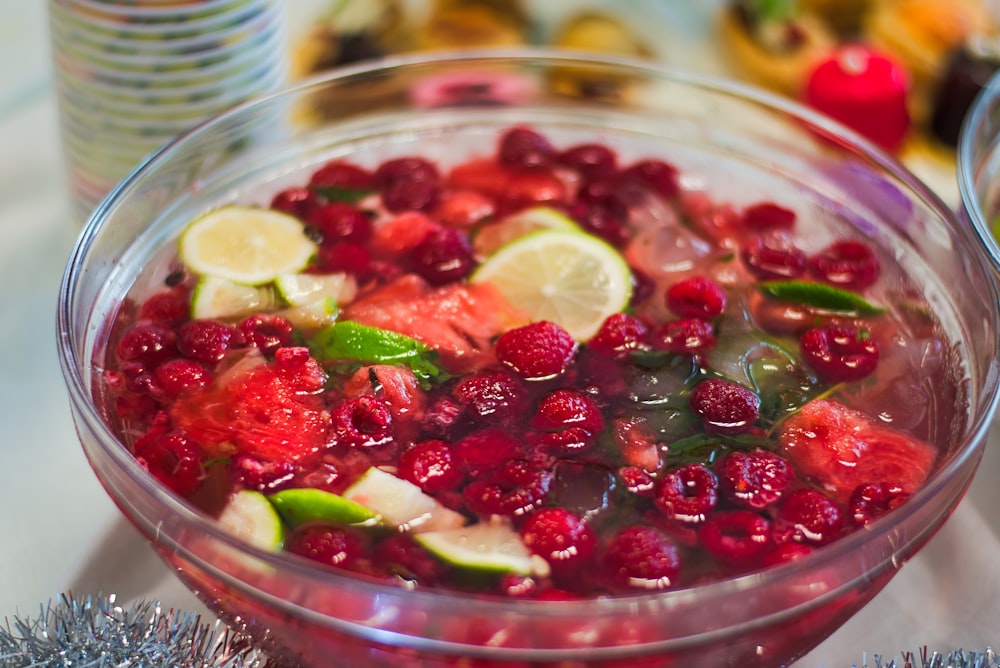 assorted fruits on clear glass bowl