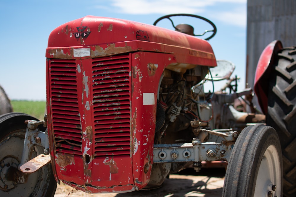 red and grey tractor during daytime