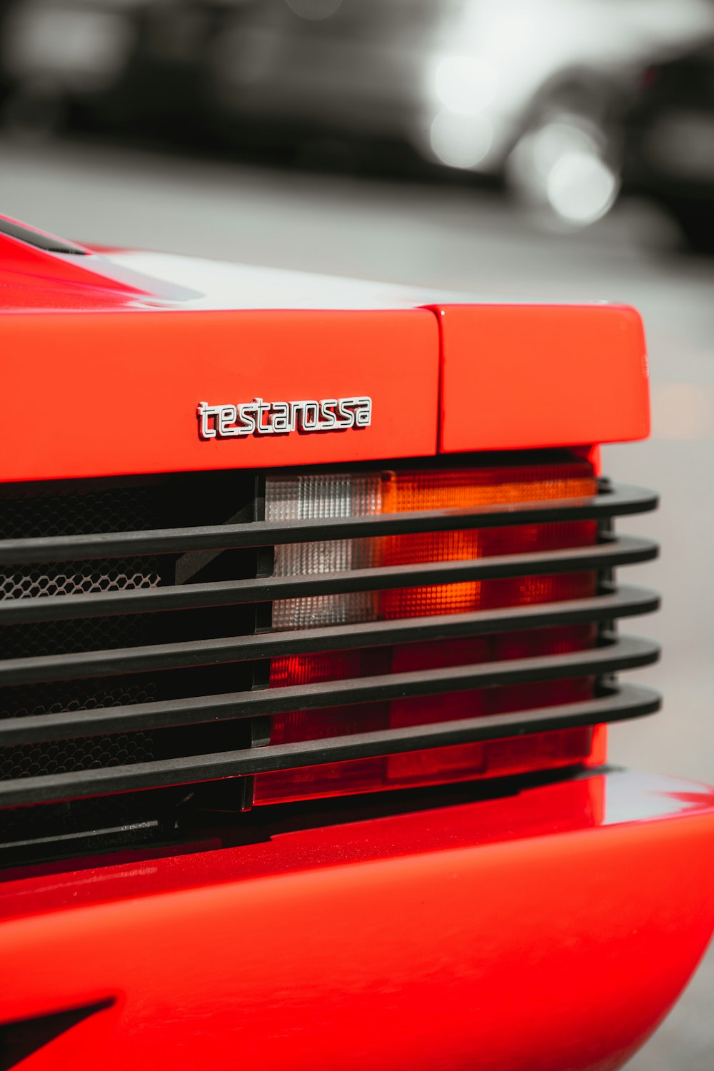 a close up of the front of a red sports car