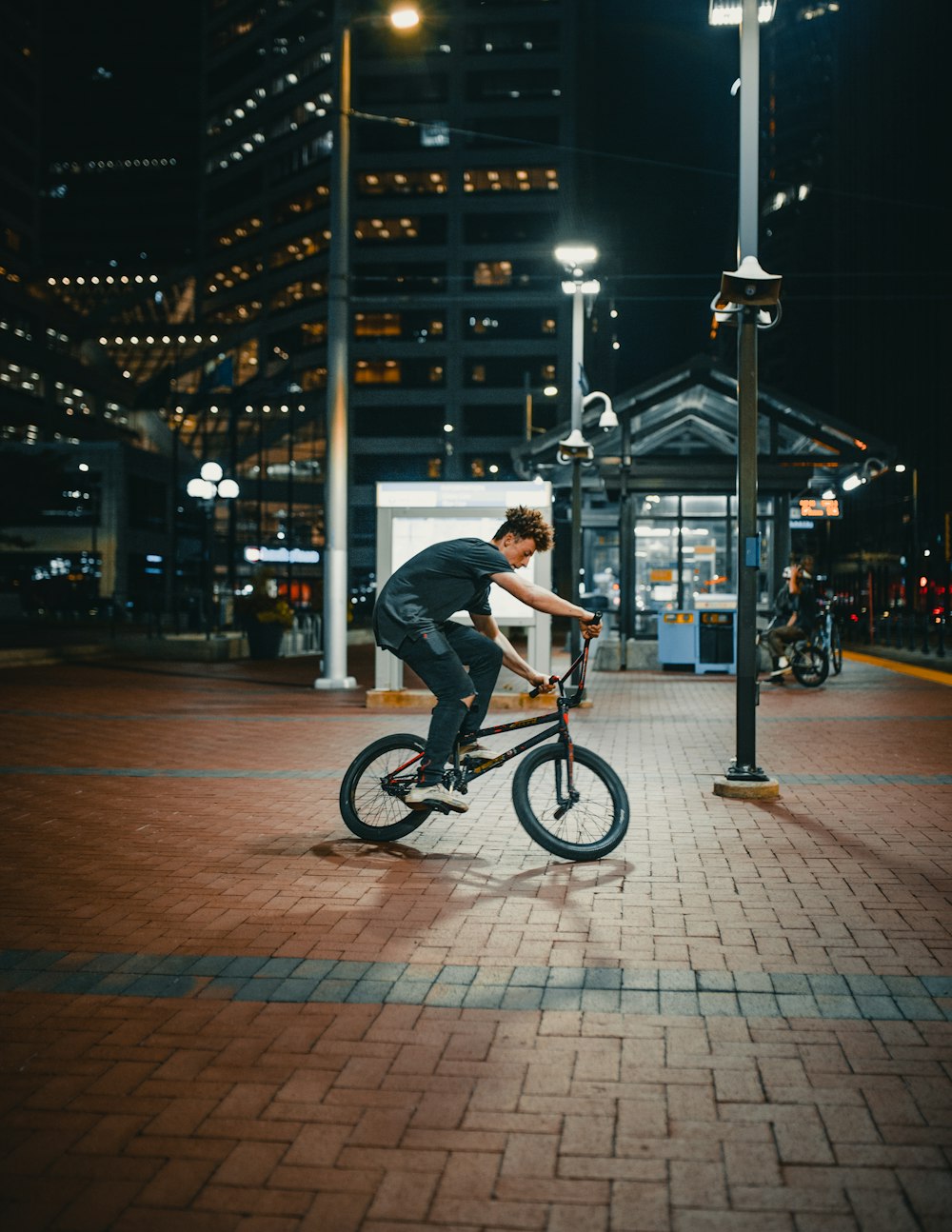 A boy on his BMX bike in an empty street