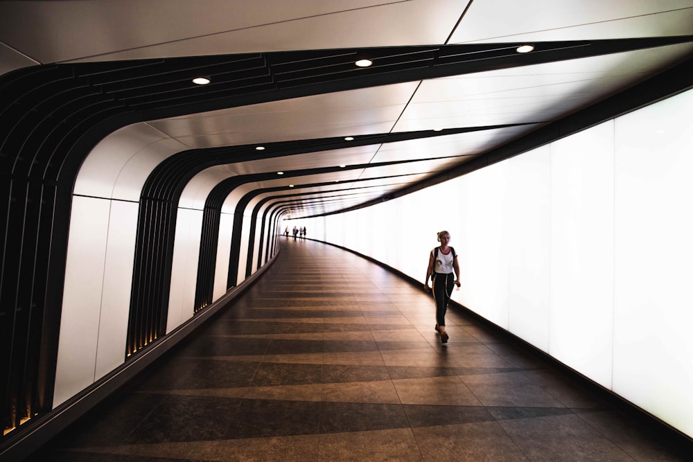 woman walking inside hallway