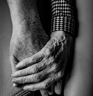 grayscale photography of human hands