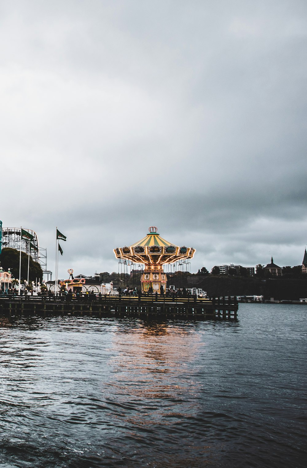 body of water across carousel swing