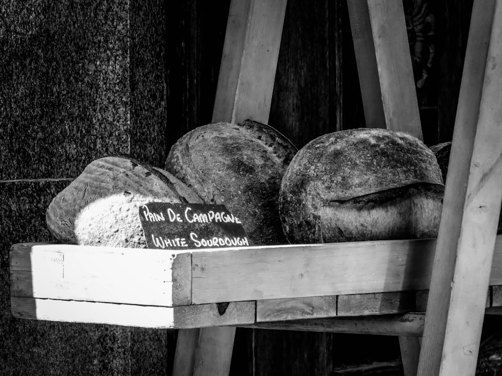 grayscale photo of wooden bench