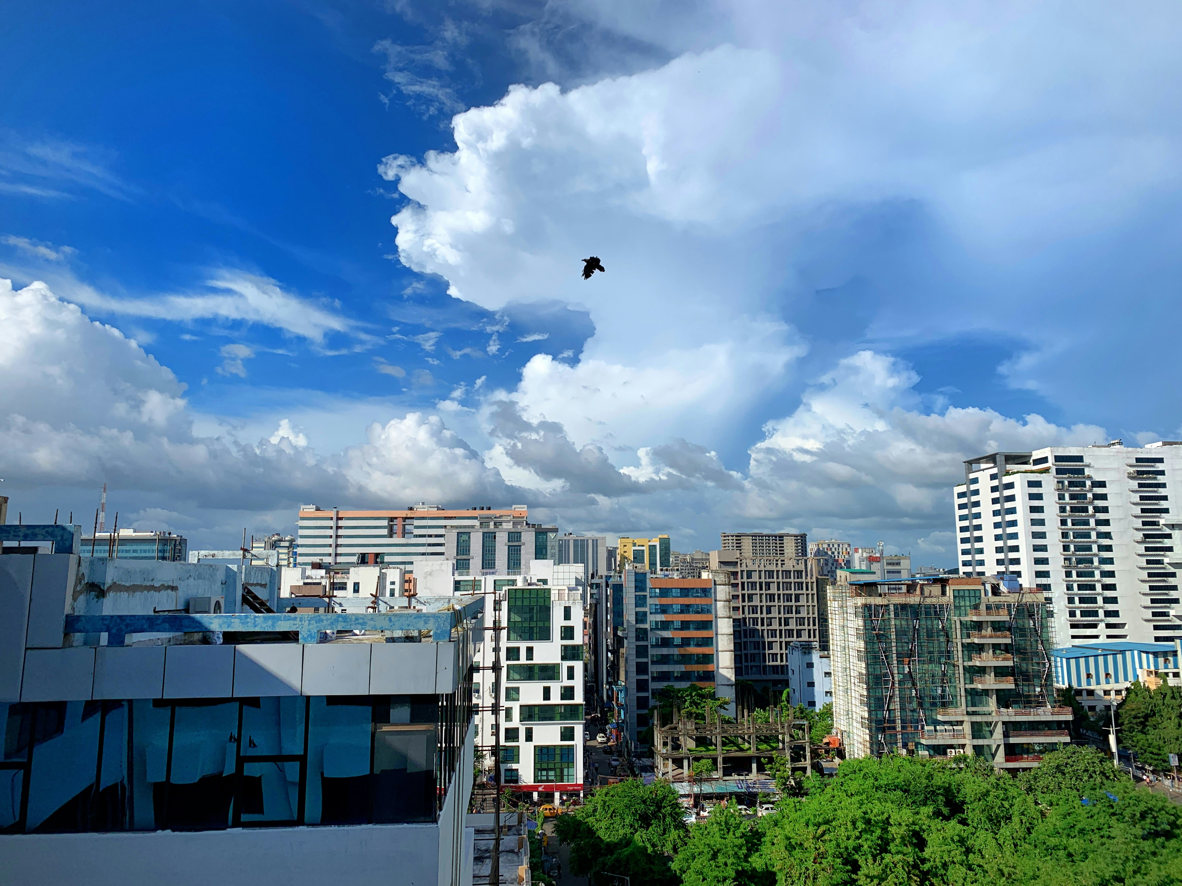 concrete buildings during daytime weather teams background