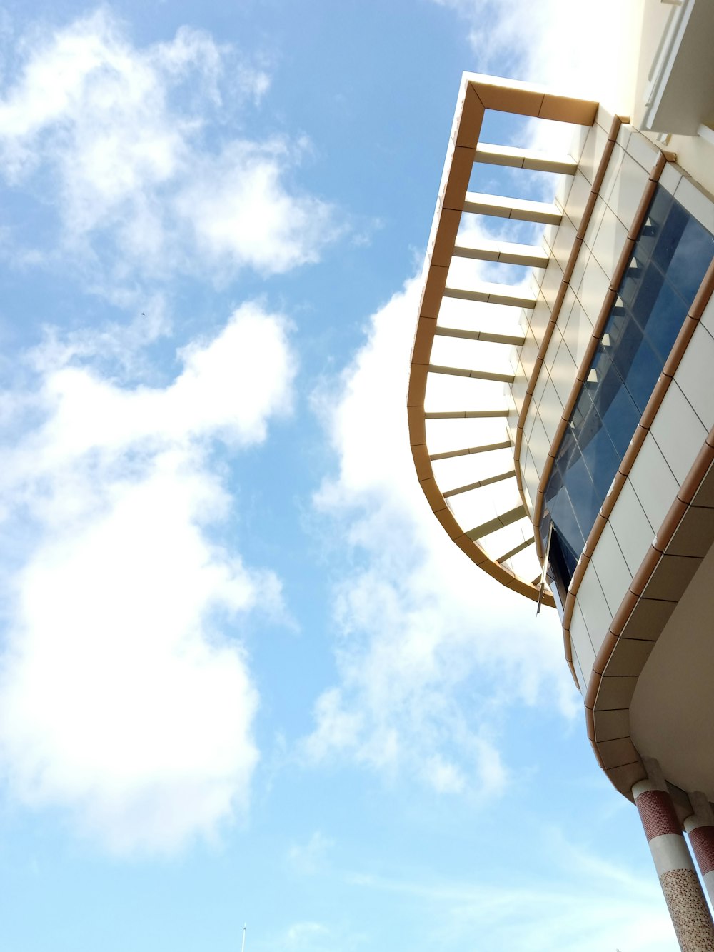 white and brown building under blue sky