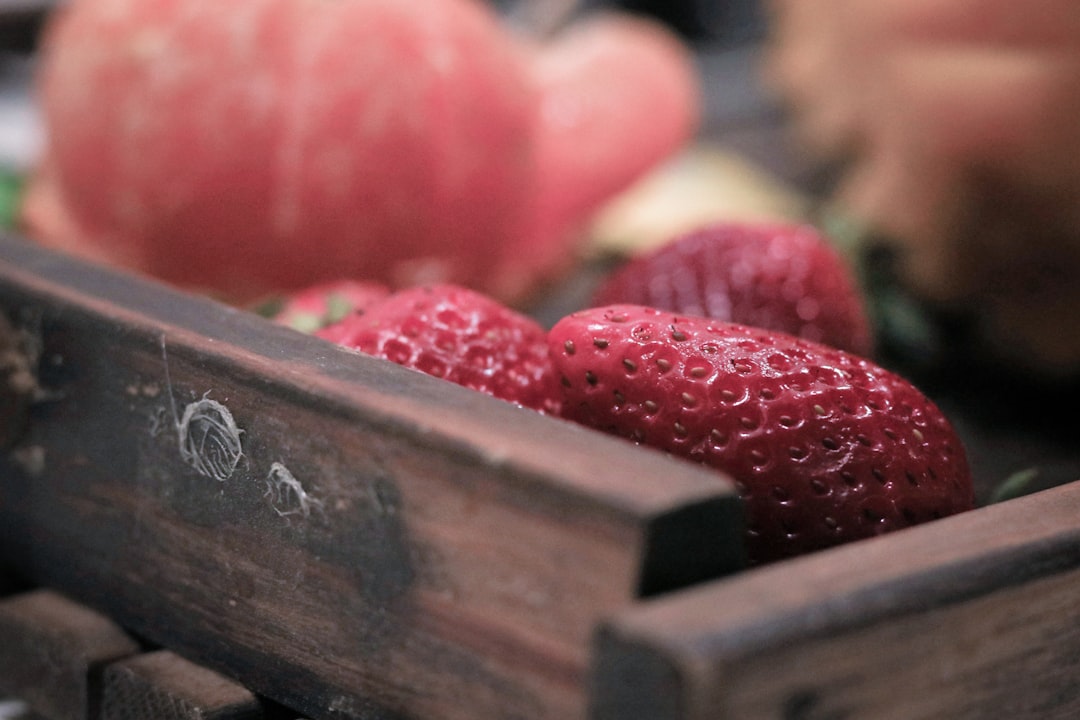 red strawberries in wooden tray