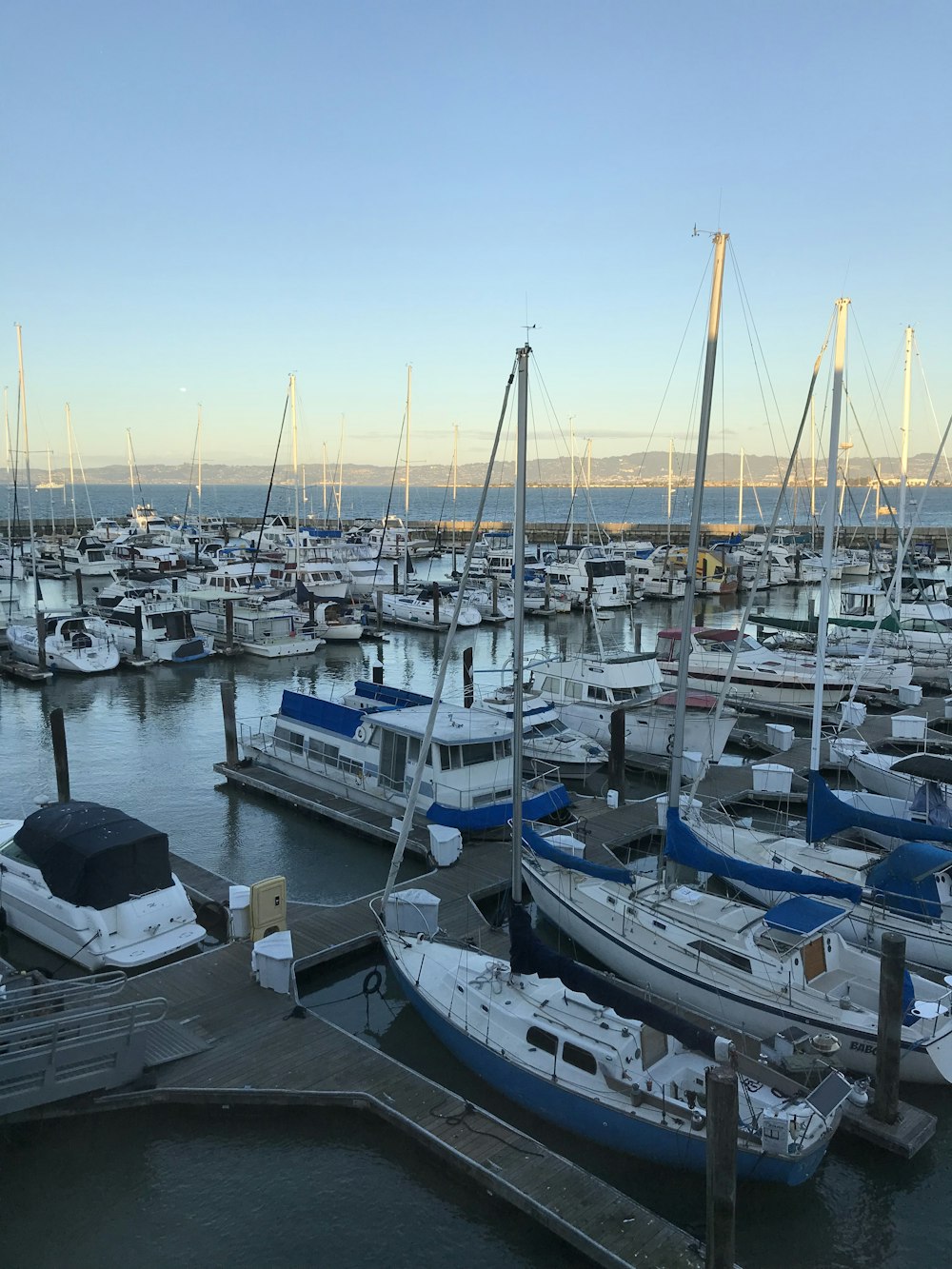 boats docked beside docks during day