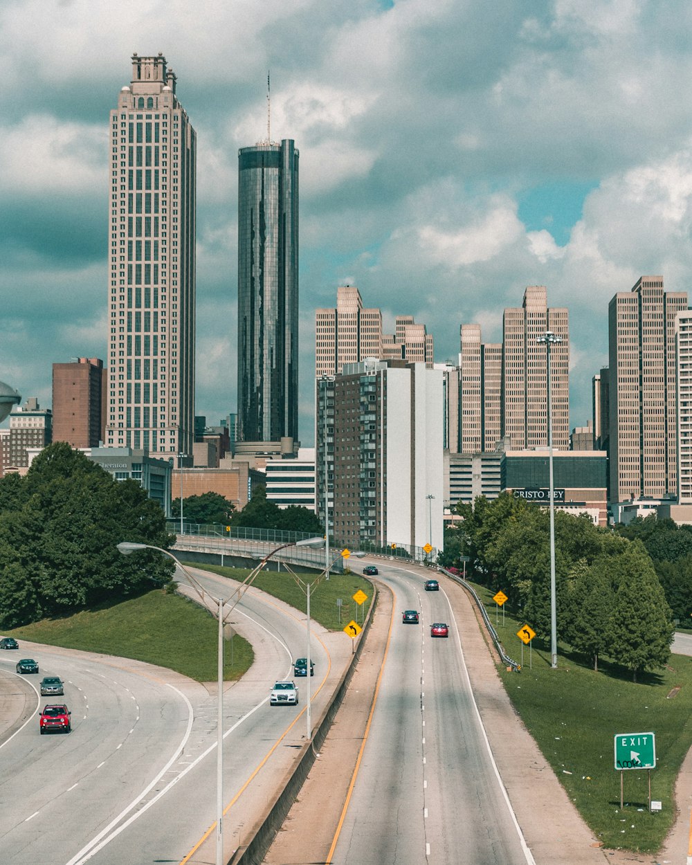 photography of vehicle traveling on road during daytime