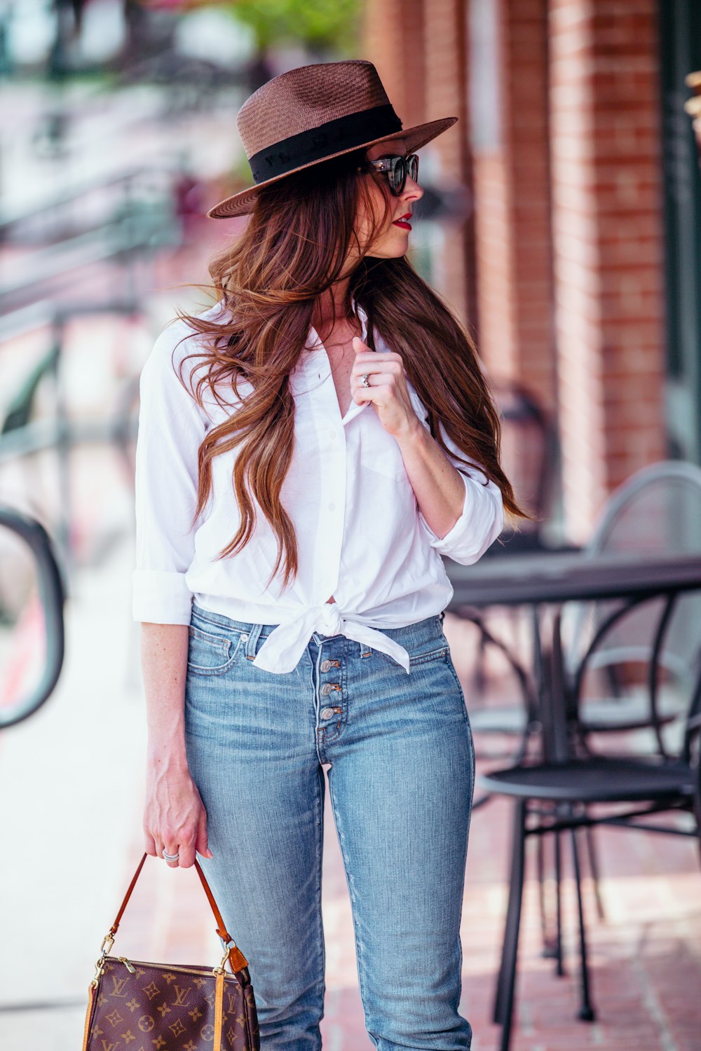 women's white dress shirt and blue jeans