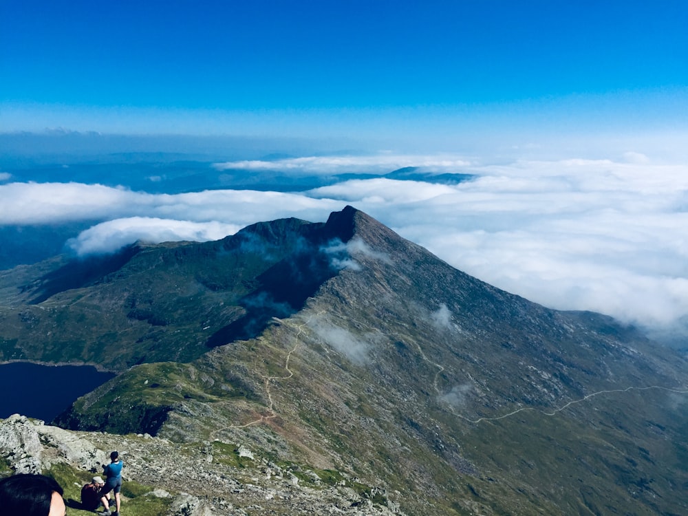 mountain ridge and bed of clouds