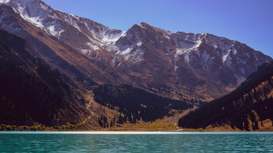 calm water during golden hour in Ile-Alatau National Park Kazakhstan