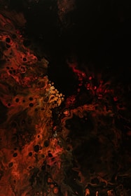 a black background with red and yellow swirls