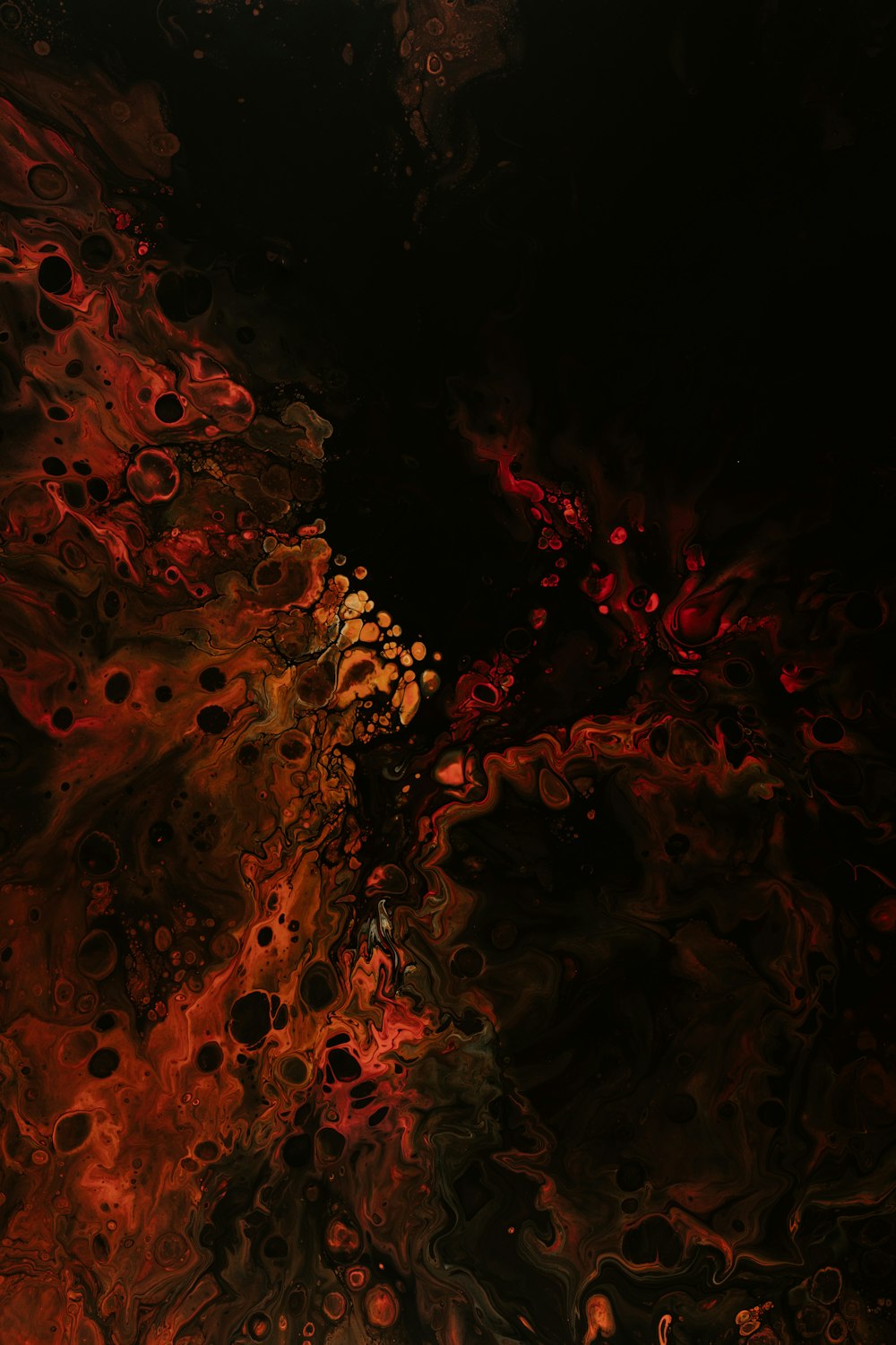 a black background with red and yellow swirls