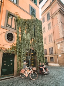 two people sitting beside green ivy plants
